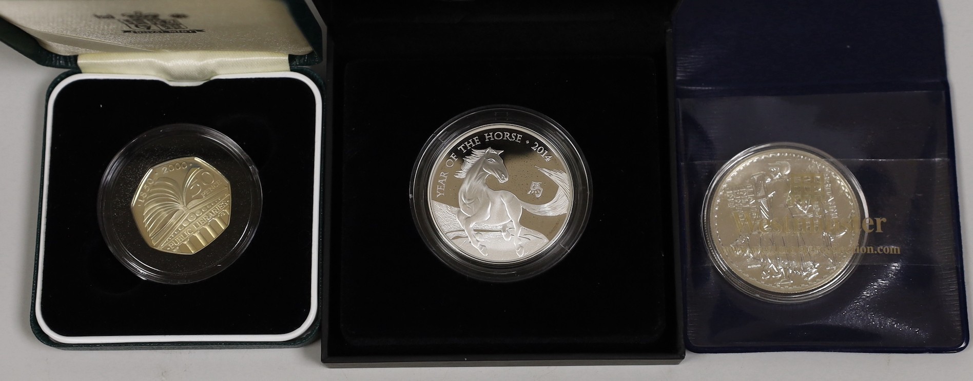 Royal Mint Lunar Year of the Horse 2014 1oz. silver proof coin a 150 years of Public Libraries silver proof 50p 2000 and a Westminster Mint Bill bullion Britannia 1oz coin.